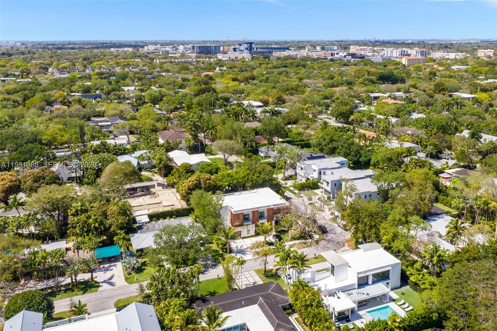 7700 Southwest 50th Court Miami, FL 33143 - Photo 61 of 62 an aerial view of residential building with parking and yard
