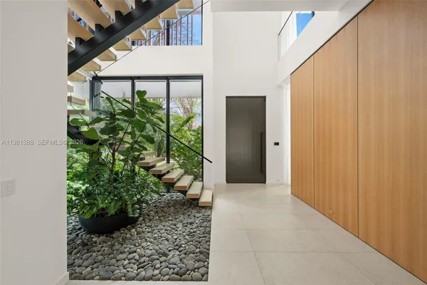 a view of an empty room with a sliding door