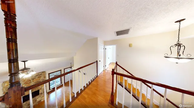 a view of entryway with wooden floor