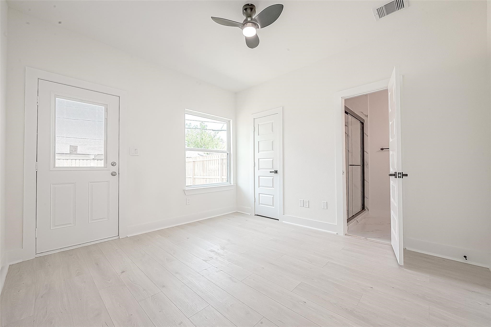 4135 Mallow Street, Unit A Houston, TX 77051 - Photo 12 of 12 an empty room with fan and windows
