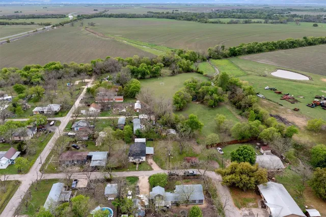 an aerial view of ocean with residential house with outdoor space and lake view