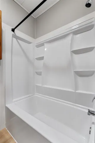 a close view of bathtub in closet