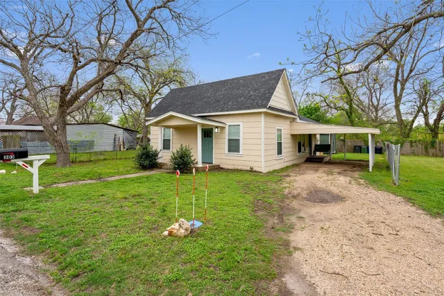 front view of a house with a yard