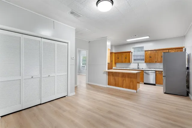 a view of kitchen with wooden floor