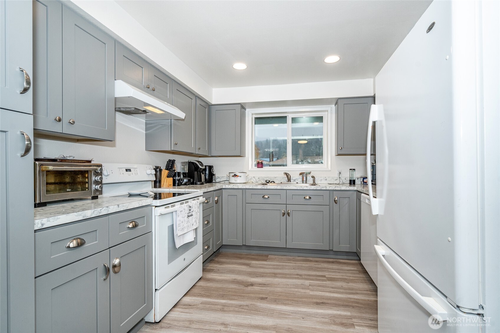 2119 Southwest Olympic Drive Chehalis, WA 98532 - Photo 11 of 33 a kitchen with sink cabinets and window