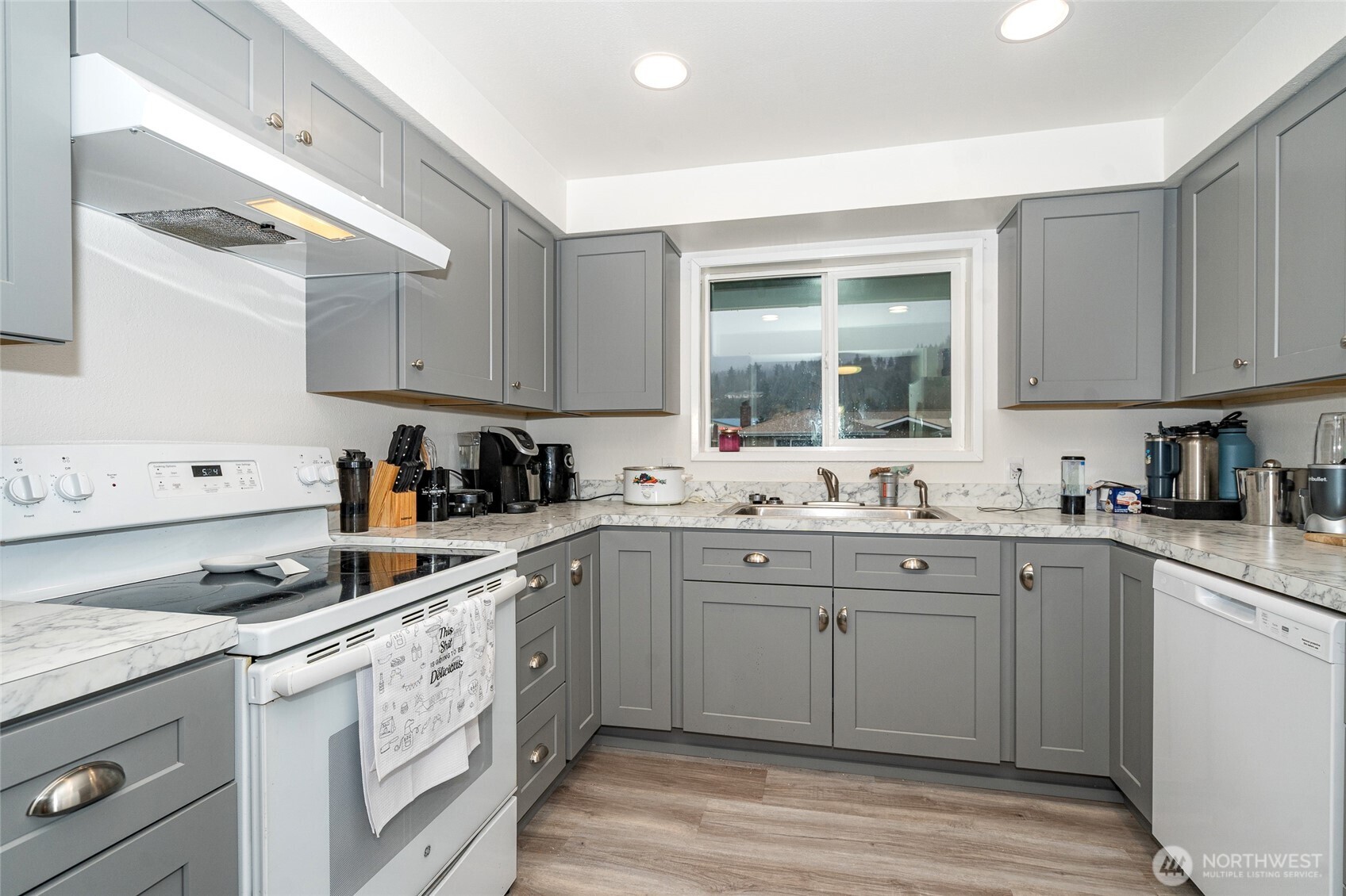 2119 Southwest Olympic Drive Chehalis, WA 98532 - Photo 13 of 33 a kitchen with cabinets appliances a sink and a window
