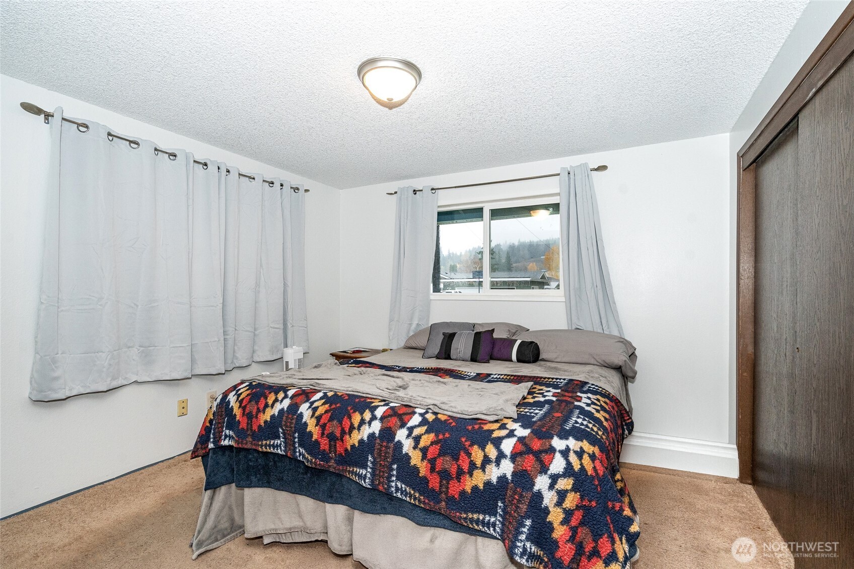 2119 Southwest Olympic Drive Chehalis, WA 98532 - Photo 16 of 33 a bedroom with a bed and a window