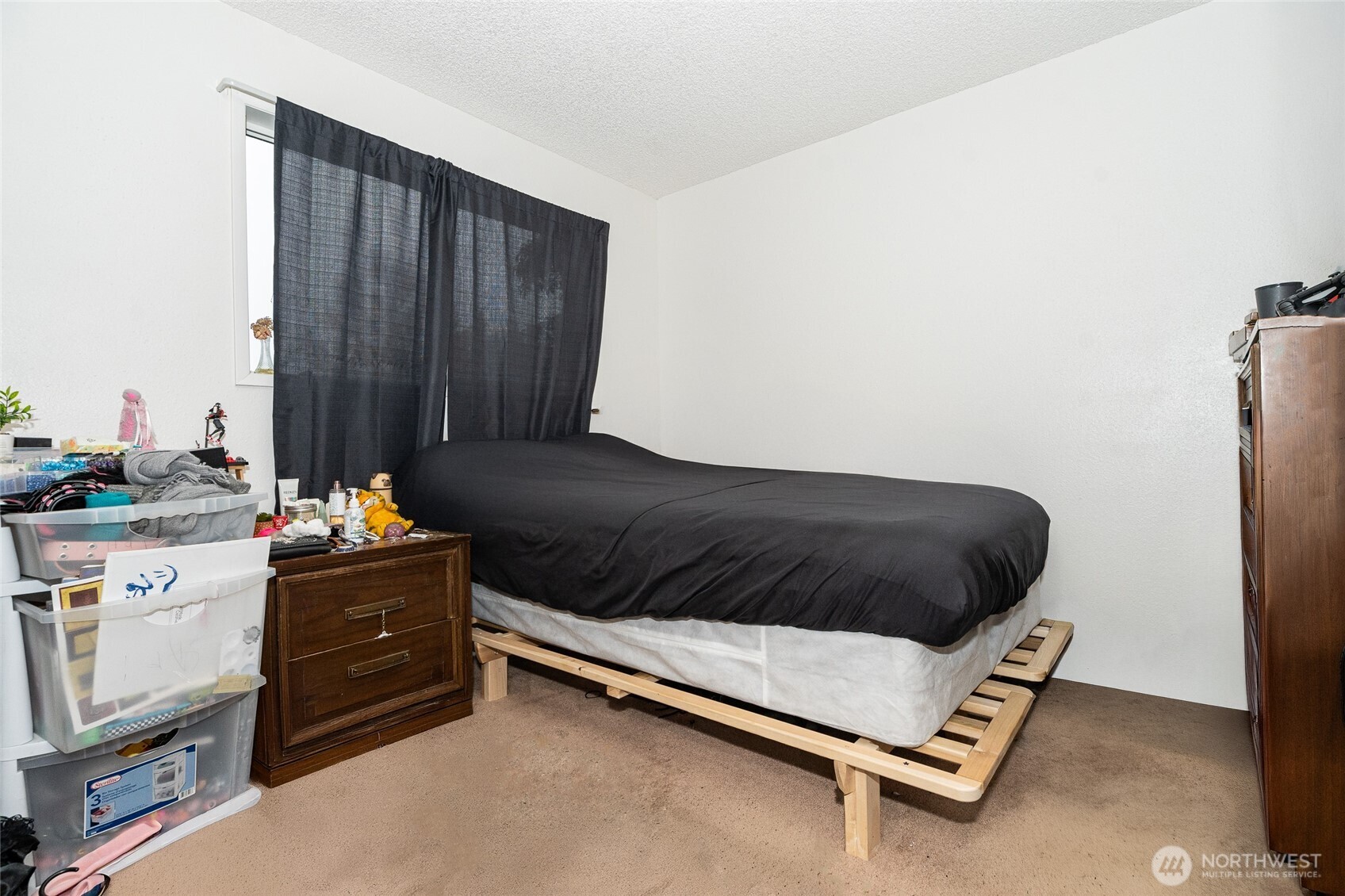 2119 Southwest Olympic Drive Chehalis, WA 98532 - Photo 22 of 33 a bedroom with a bed and cabinets