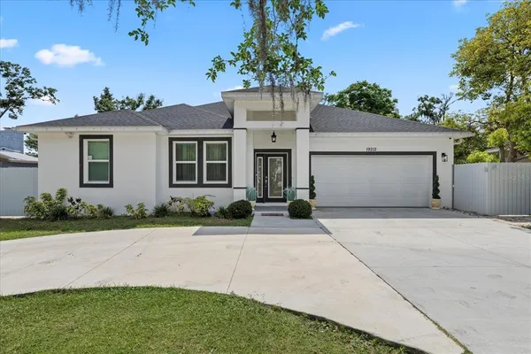 front view of a house with a yard