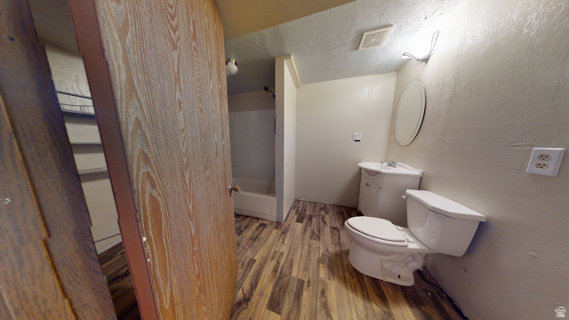 1348 Sagewood Road Price, UT 84501 - Photo 28 of 34 Full bathroom featuring vanity, wood finished floors, a textured wall, shower combination, and a textured ceiling