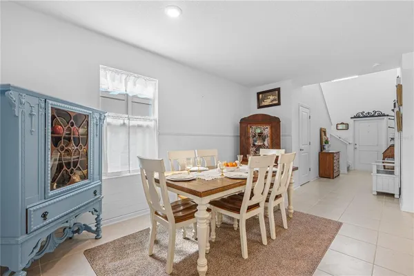 a dining room with furniture and window