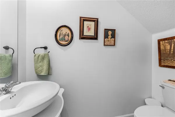 a bathroom with a toilet and a sink