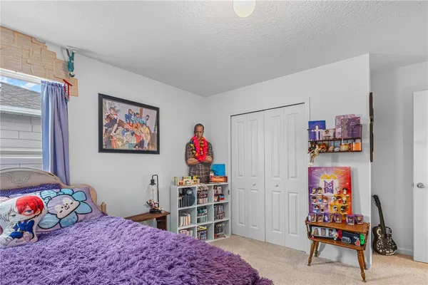 a bedroom with furniture and a wooden floor