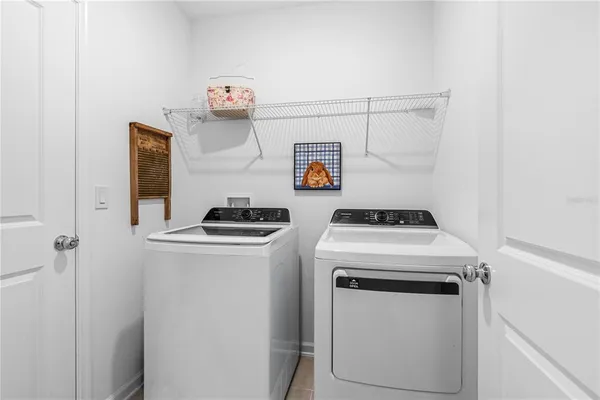 a utility room with dryer and washer