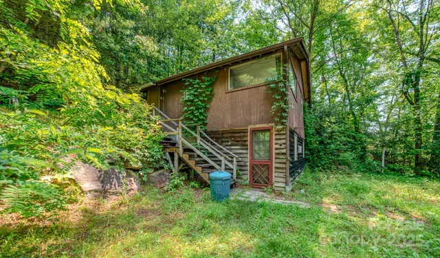 a backyard of a house with lots of green space