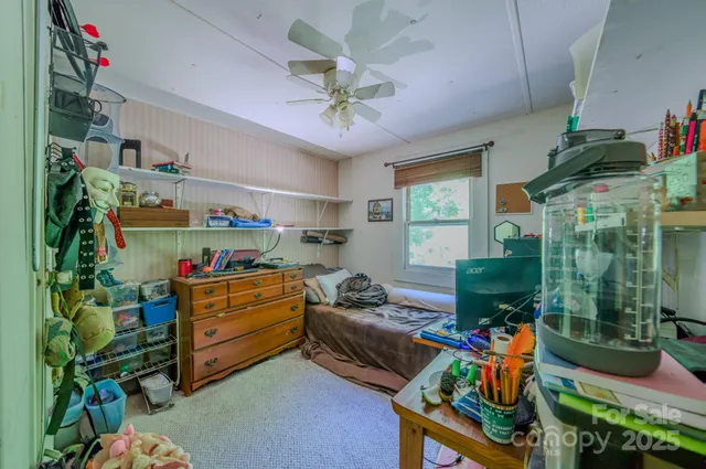 a room with furniture a chandelier and a window