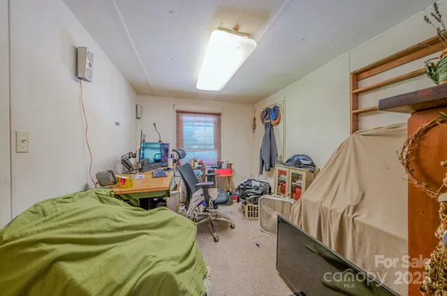 a bed room with two beds and a couch