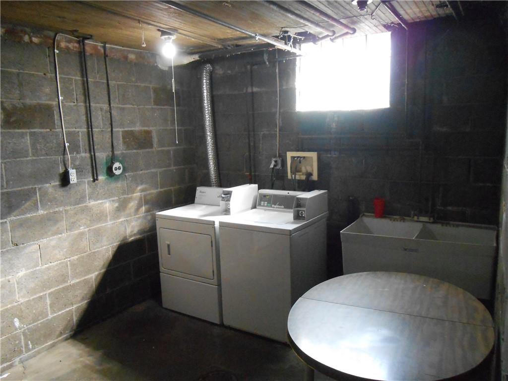 219 5th Street, Unit 1 Dravosburg, PA 15034 - Photo 15 of 16 a bathroom with a sink toilet and shower