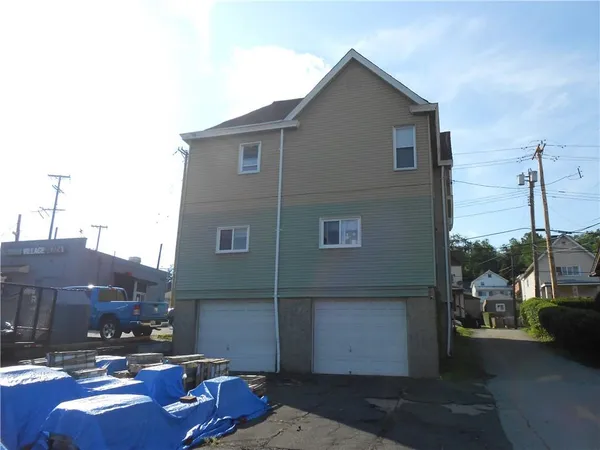 a front view of a house with patio