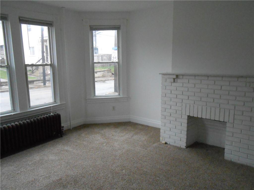 219 5th Street, Unit 1 Dravosburg, PA 15034 - Photo 7 of 16 an empty room with windows
