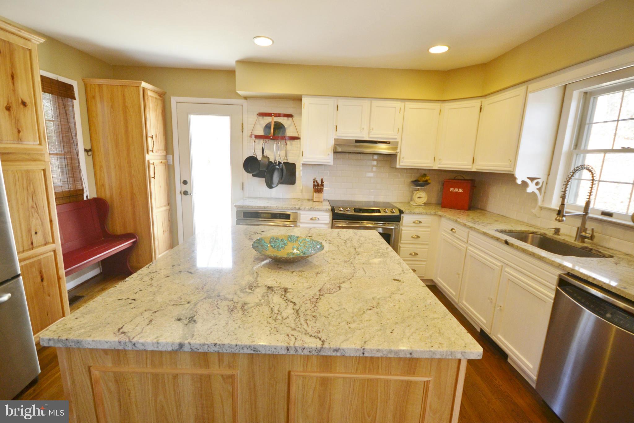 5070 Shaffer Mill Road Manchester, MD 21102 - Photo 2 of 30 a kitchen with stainless steel appliances granite countertop sink stove refrigerator and cabinets