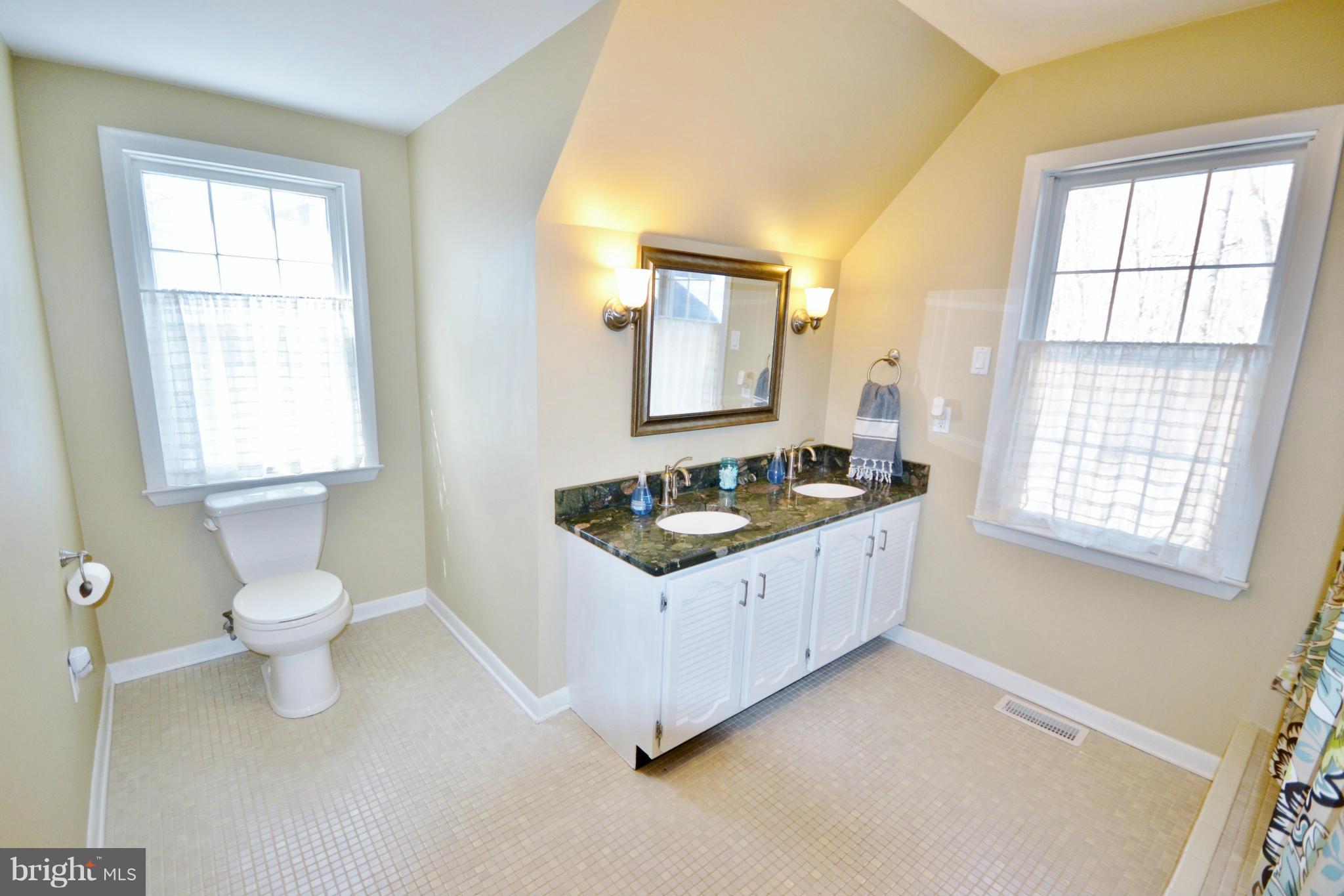 5070 Shaffer Mill Road Manchester, MD 21102 - Photo 19 of 30 a kitchen with granite countertop a sink and a toilet