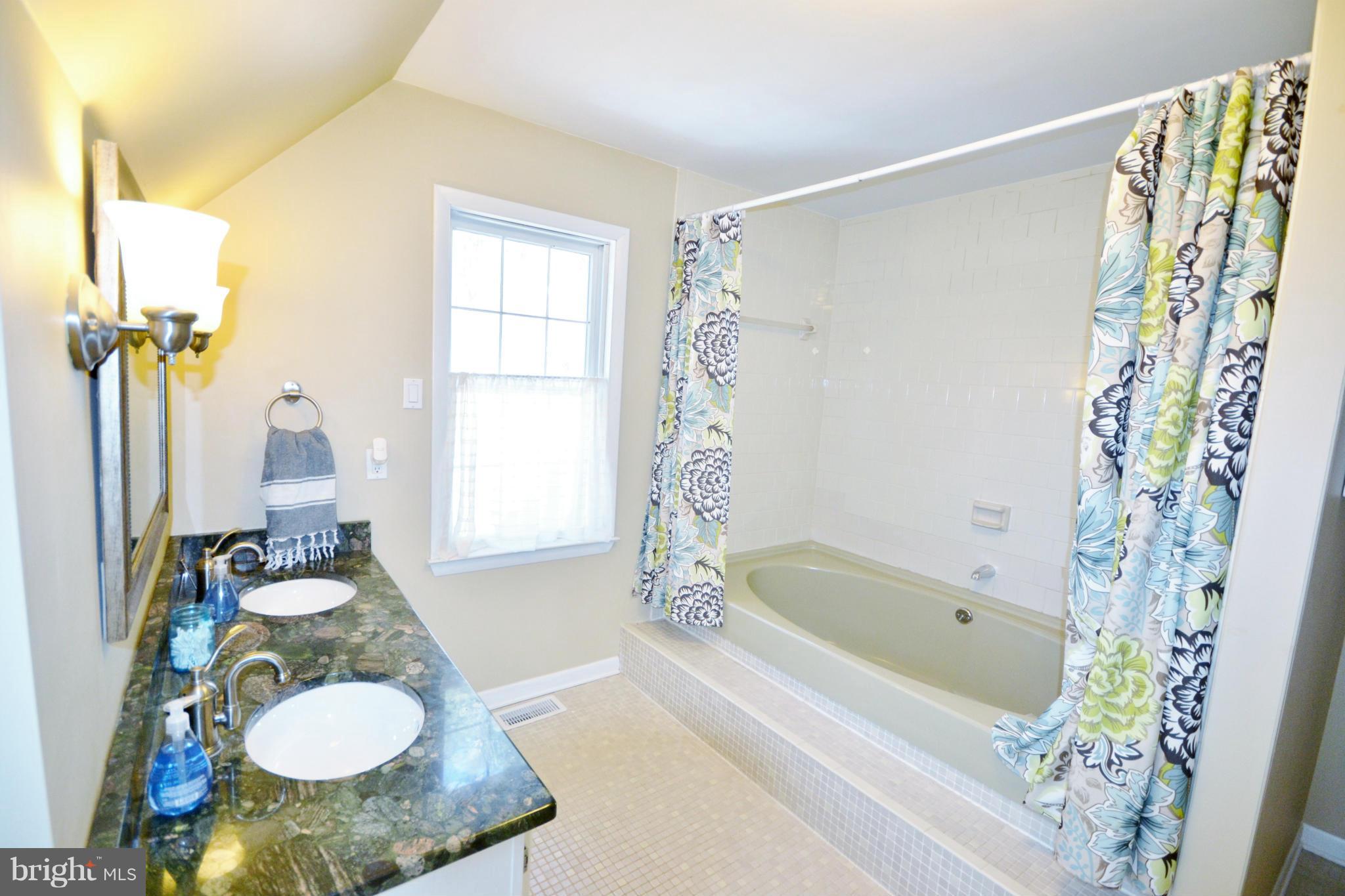 5070 Shaffer Mill Road Manchester, MD 21102 - Photo 20 of 30 a bathroom with a sink toilet and shower
