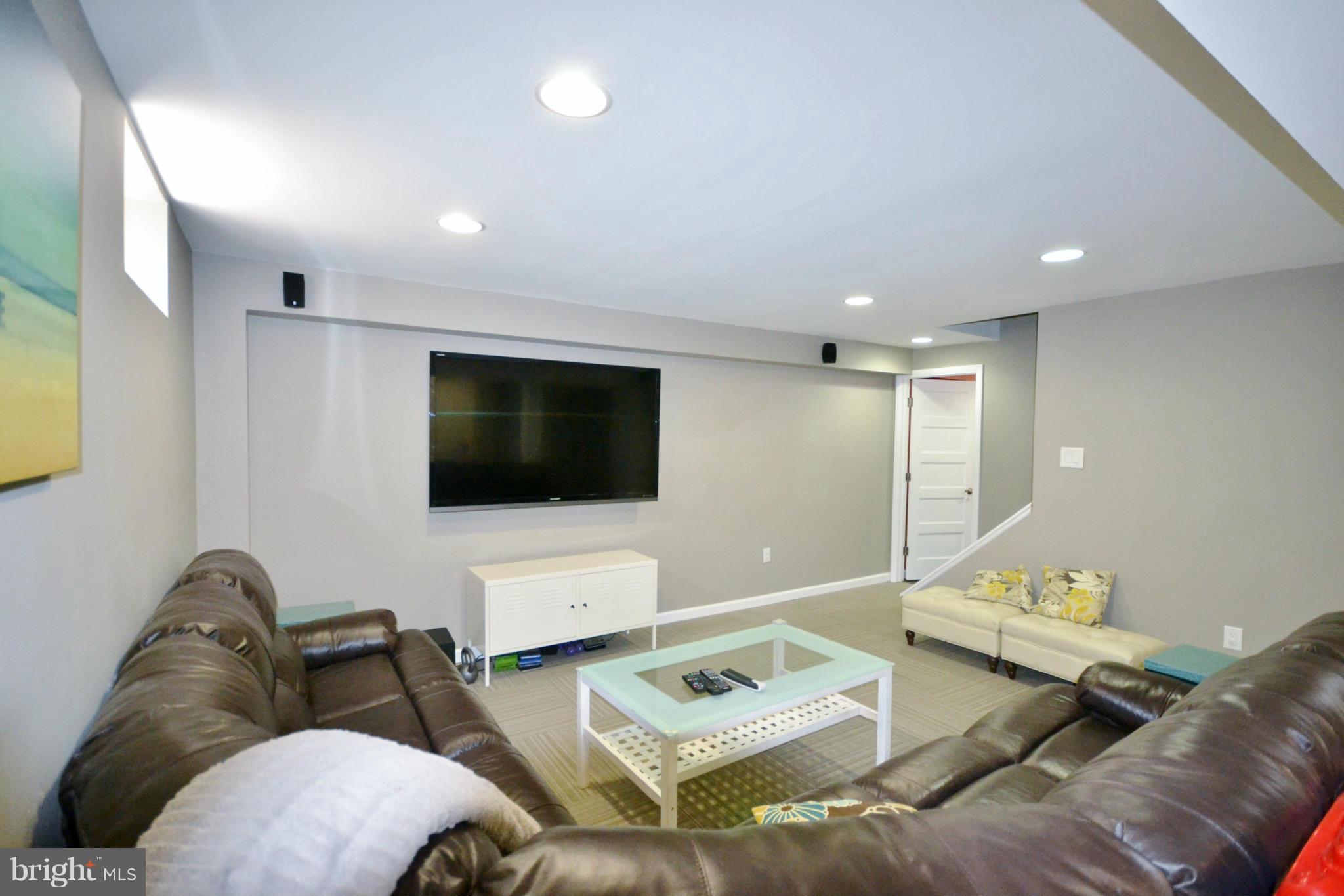 5070 Shaffer Mill Road Manchester, MD 21102 - Photo 23 of 30 a living room with furniture and a flat screen tv