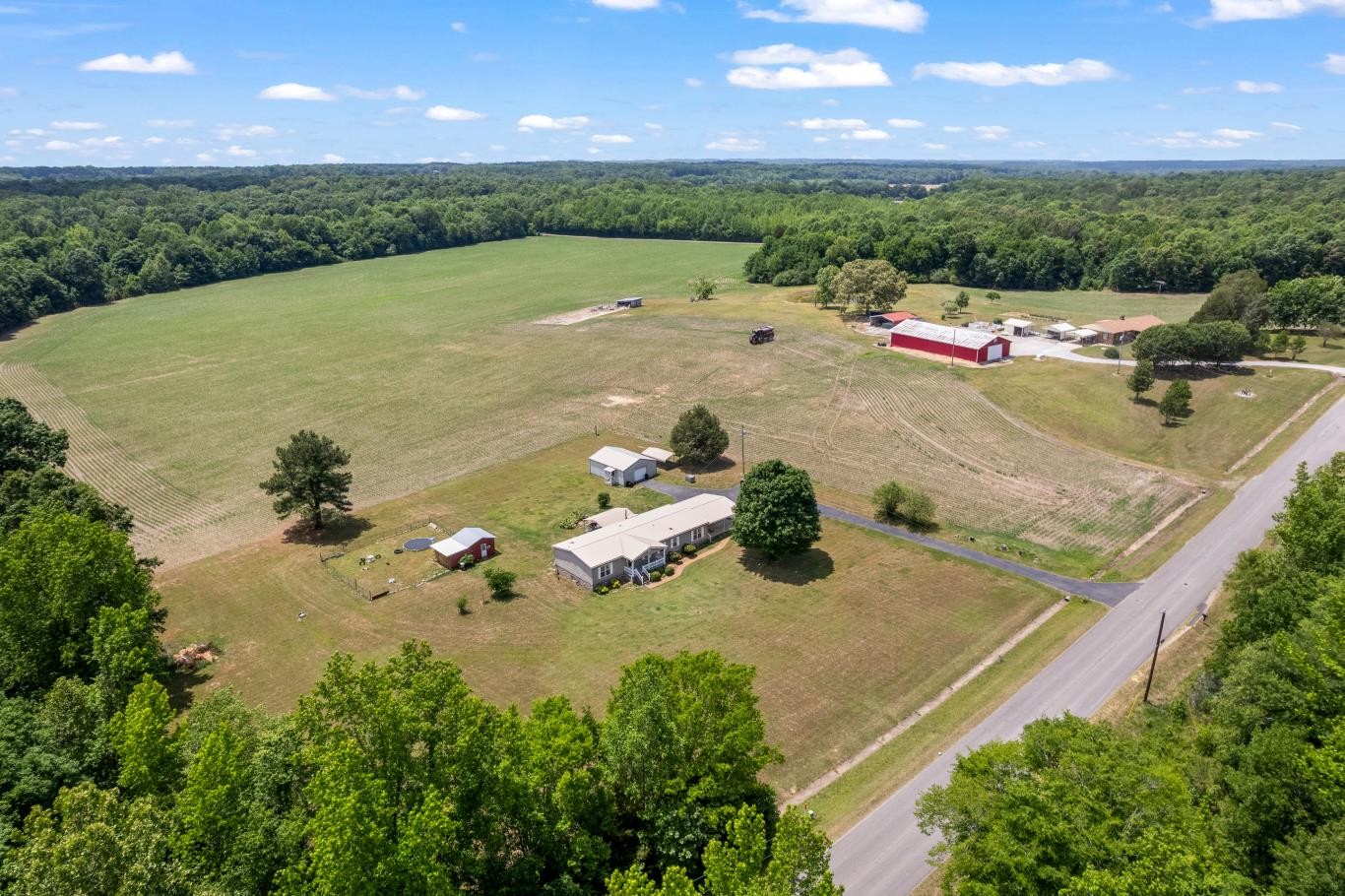 6439 Cedar Grove Road Big Sandy, TN 38221 - Photo 35 of 38 an aerial view of a house with a yard
