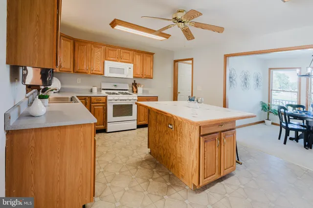 a view of a storage and utility room with washer and dryer