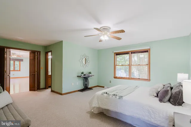 a bathroom with a shower and toilet