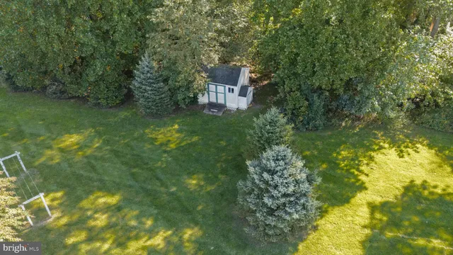 a view of a pool with a yard