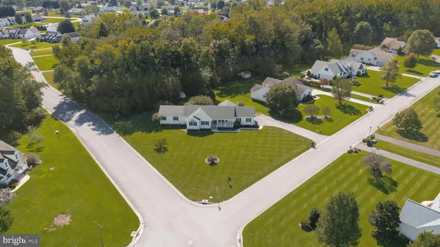 a view of a swimming pool with a yard and small pool