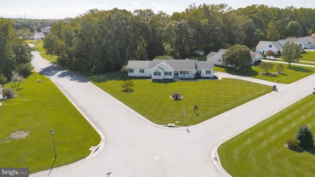 an aerial view of a house with a swimming pool