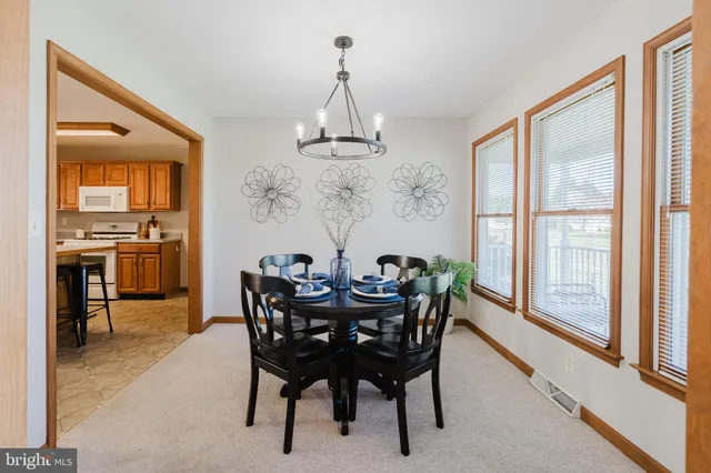 a view of a dining room with furniture window and outside view
