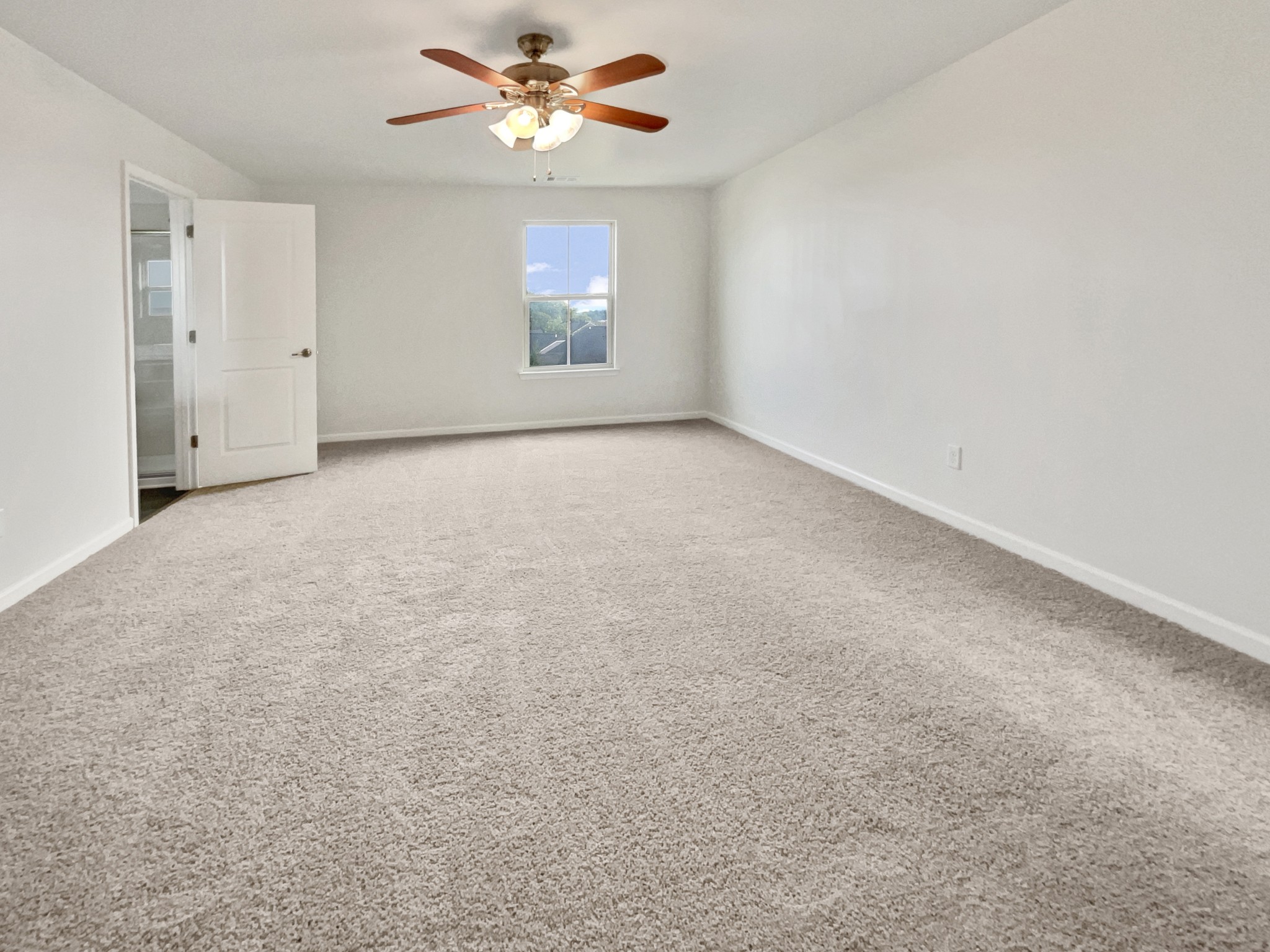 2817 Winterberry Drive Columbia, TN 38401 - Photo 13 of 26 an empty room with a chandelier fan and windows