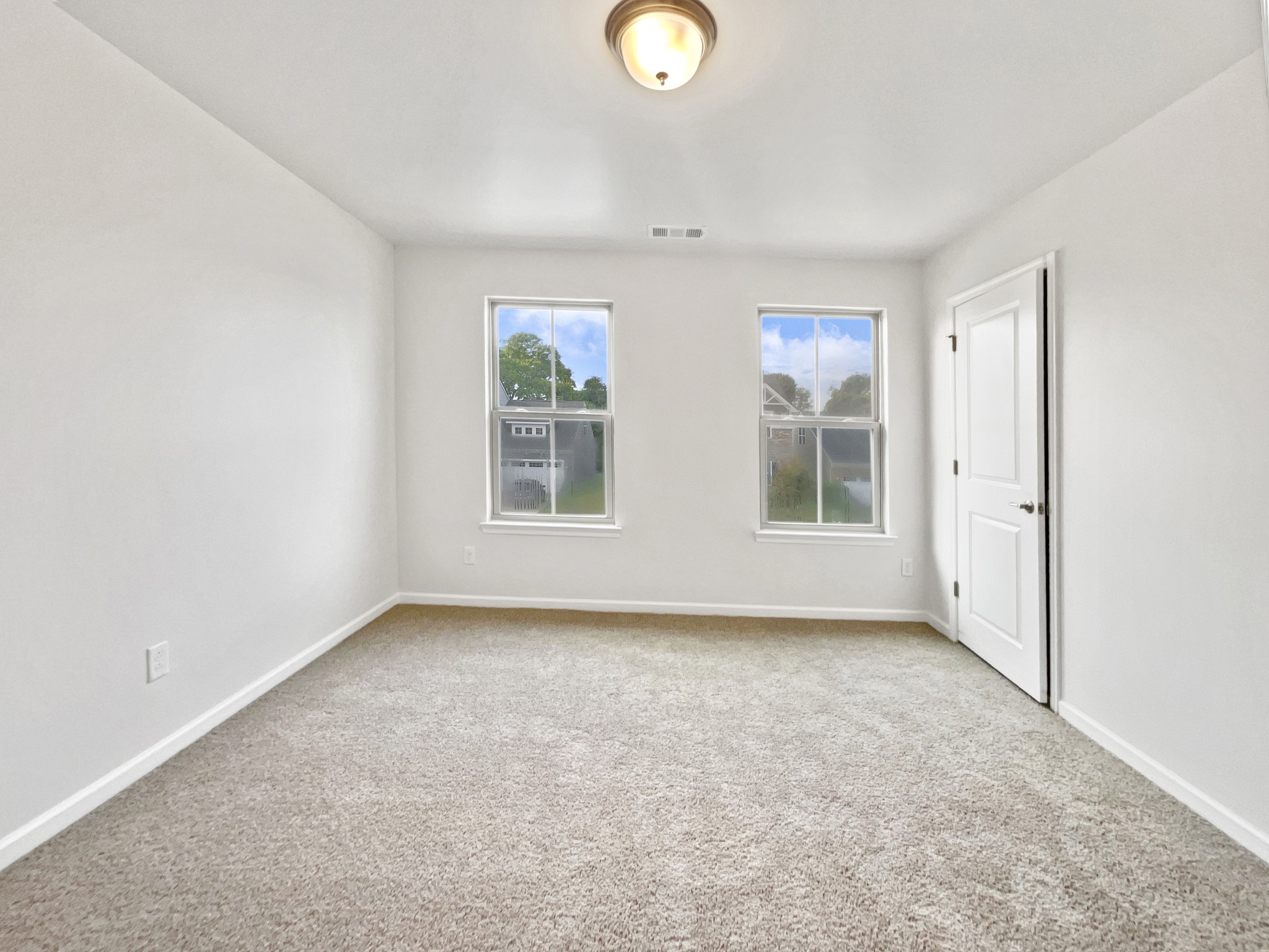 2817 Winterberry Drive Columbia, TN 38401 - Photo 15 of 26 an empty room with windows and mirror
