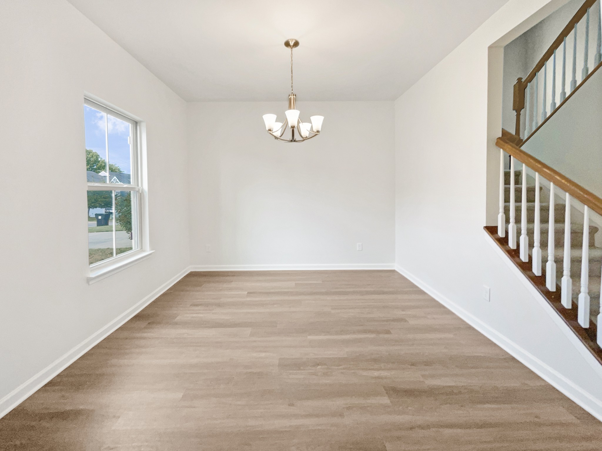2817 Winterberry Drive Columbia, TN 38401 - Photo 5 of 26 wooden floor in an empty room with a window