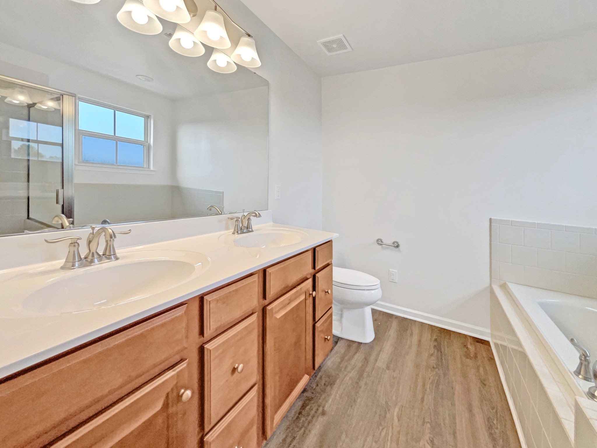 2817 Winterberry Drive Columbia, TN 38401 - Photo 9 of 26 a bathroom with a sink a toilet and a mirror