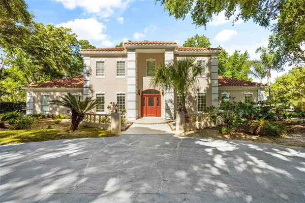 a view of a house with wooden fence