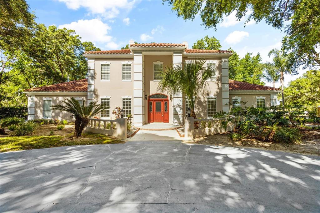 a view of a house with wooden fence