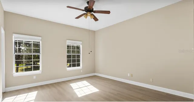 a view of empty room with windows