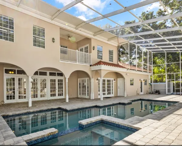 a front view of a house with swimming pool