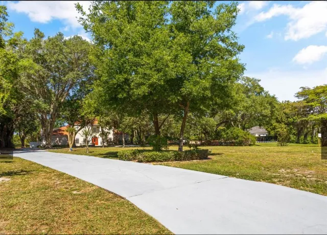 a view of a swimming pool with an outdoor space and seating area