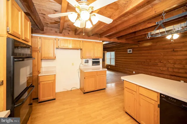 a view of a room with wooden walls
