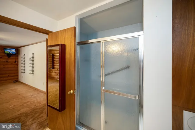 a bathroom with a glass shower door