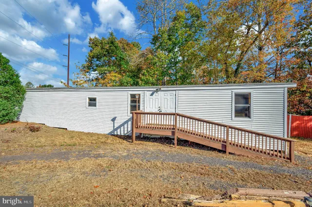 a large kitchen with lot of cabinets and stainless steel appliances