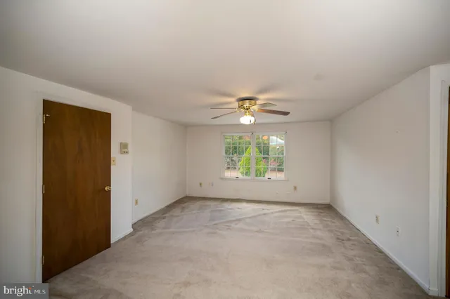 a view of a livingroom with a ceiling fan