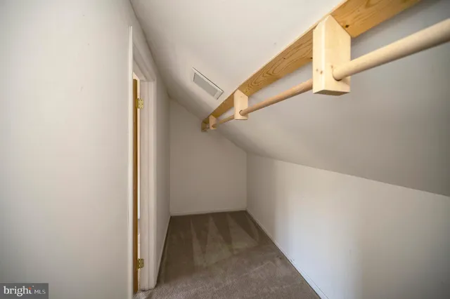 an empty room with a empty space and window