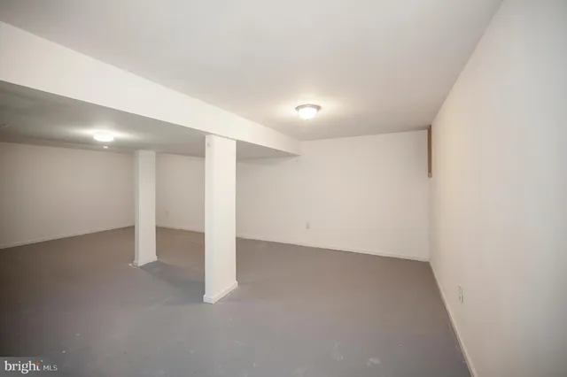 a backyard of a house with a yard and outdoor seating